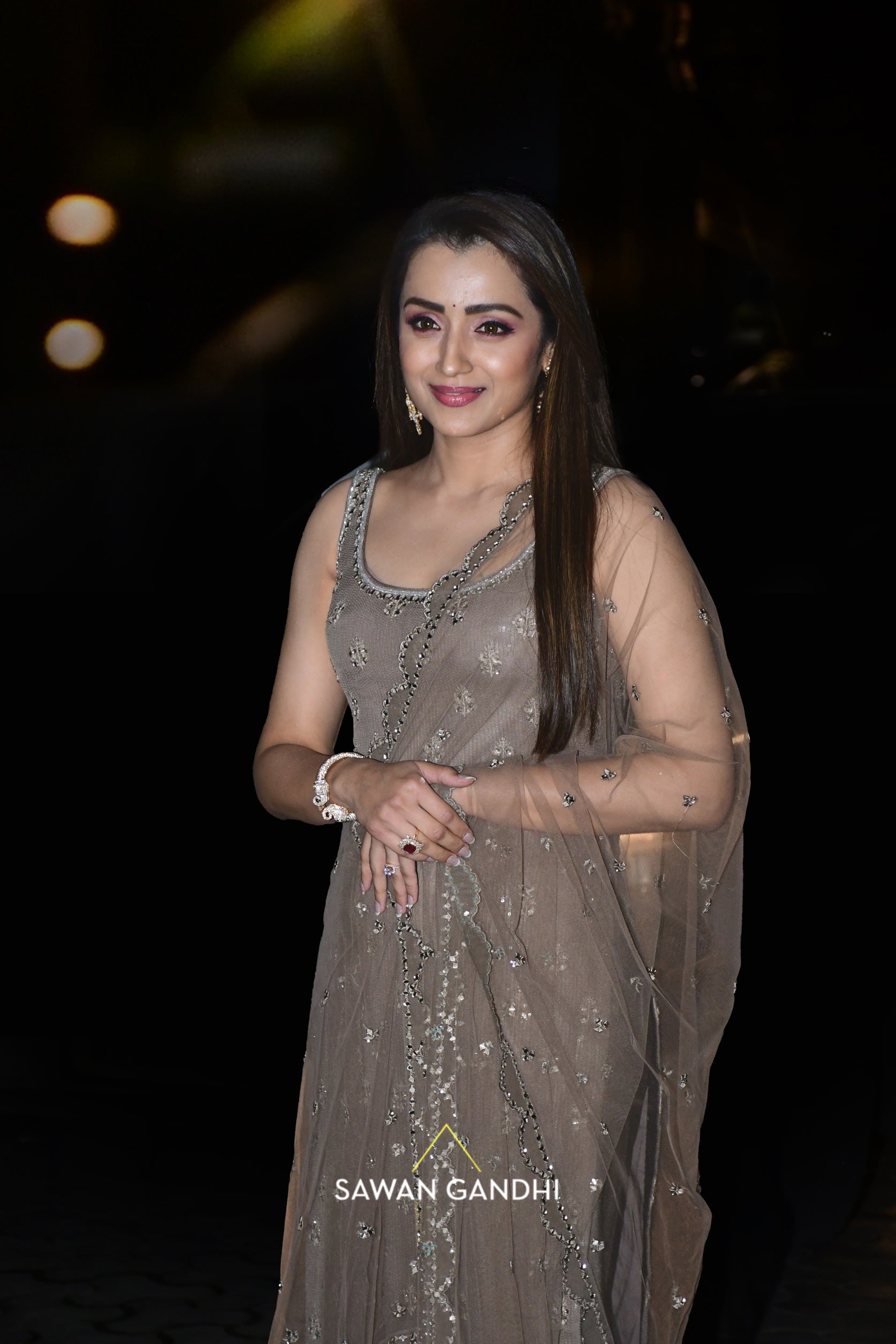 Trisha Krishnan in Taupe sequins mirror work suit