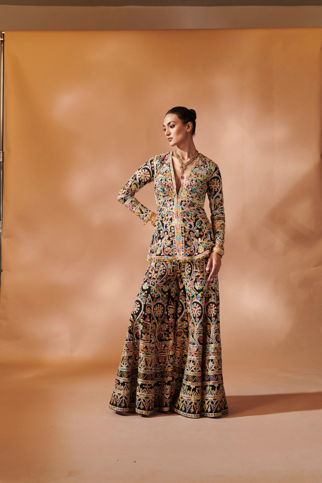 BLACK SHARARA WITH A PEPLUM KURTA