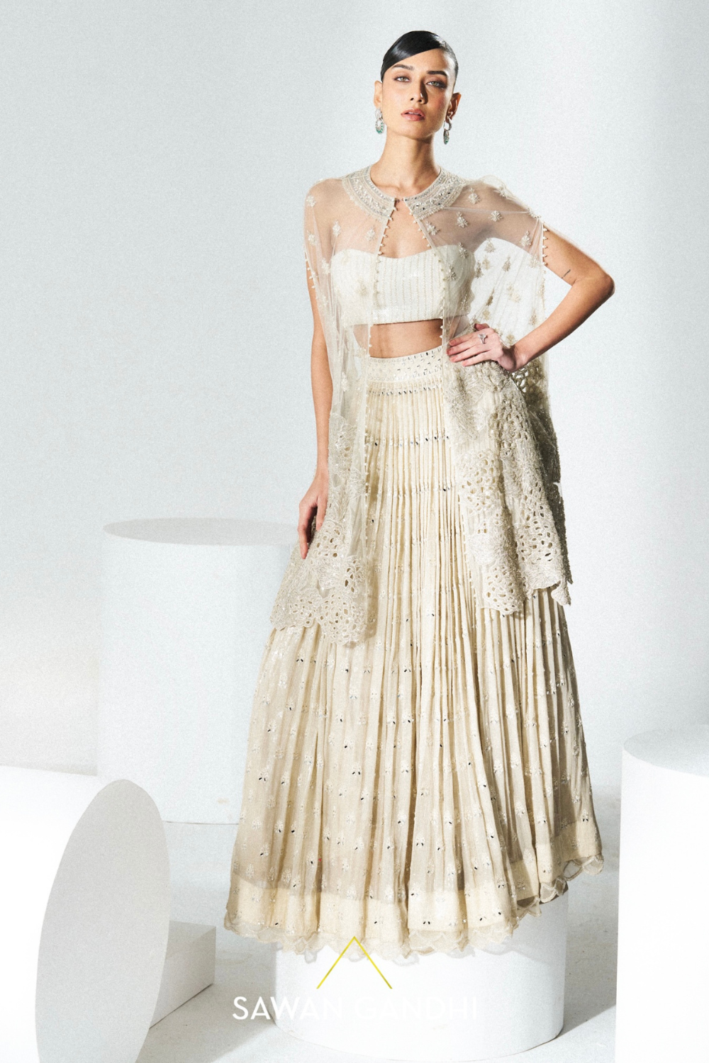 Beige sequins mirror work lehenga with cape
