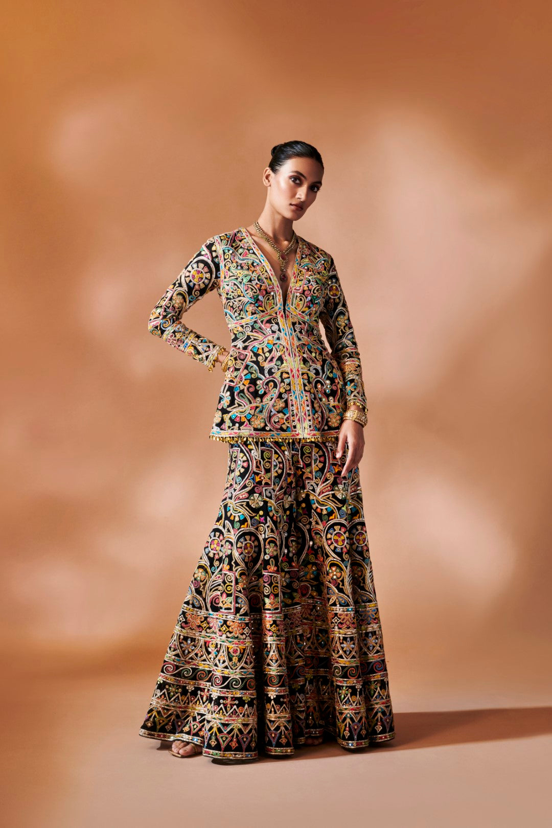 BLACK SHARARA WITH A PEPLUM KURTA
